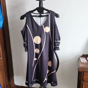 Elegant And Unique black dress with Gold Accents And Shoulder cutout sleeves.